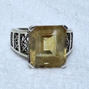 Vintage style cocktail ring features a large, rectangular emerald-cut citrine